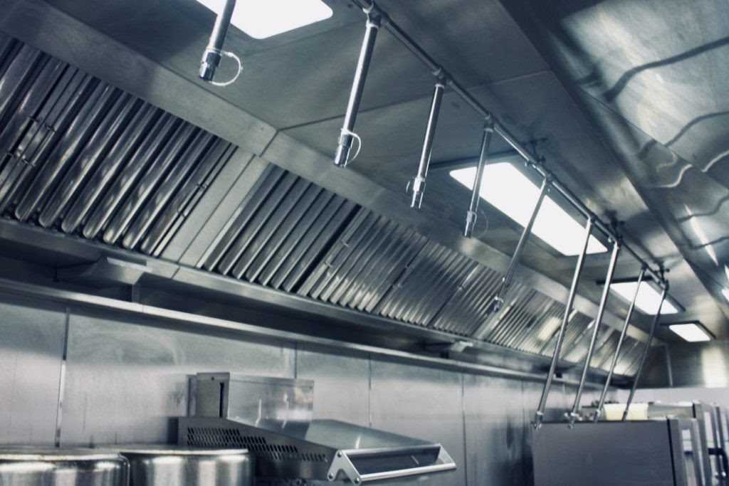 How does a kitchen hood fire suppression system work